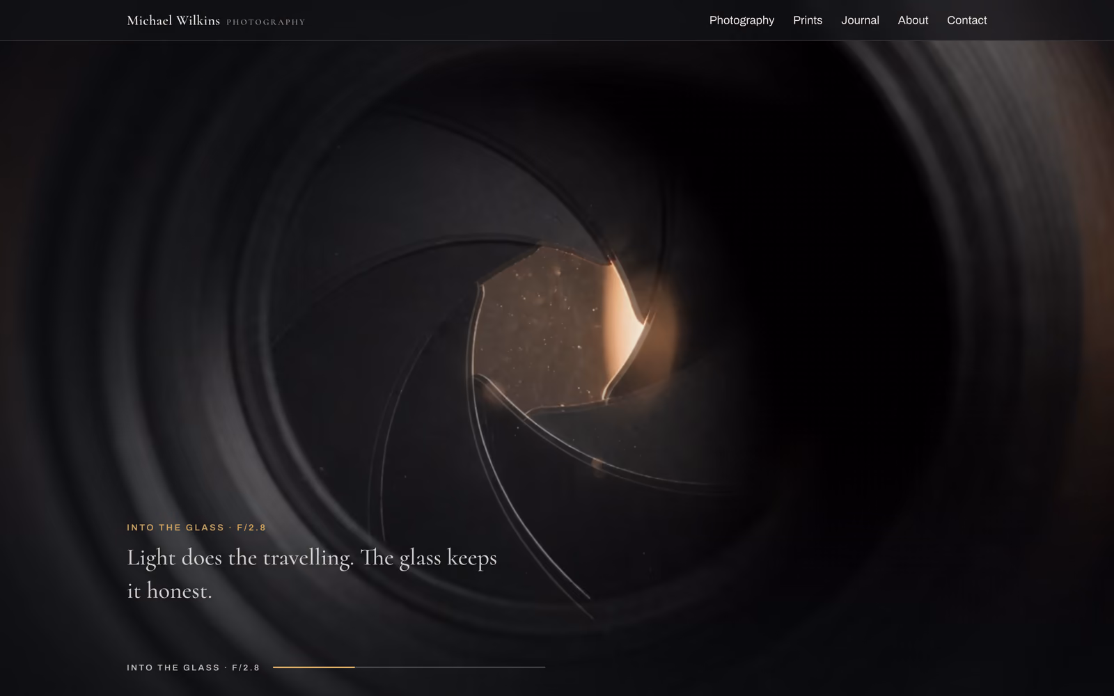 The homepage film on a desktop: the aperture blades of a lens, over the line 'Light does the travelling. The glass keeps it honest.'